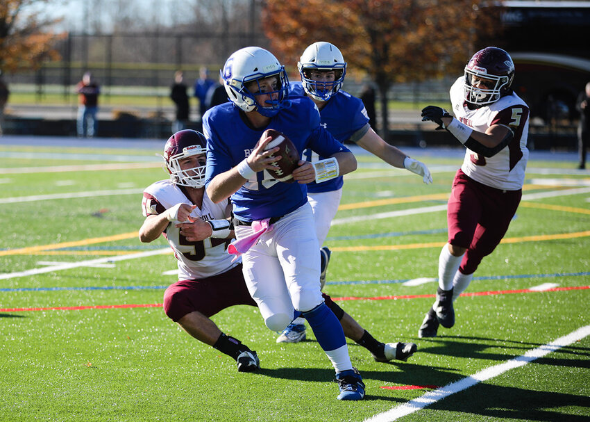 Ethan Rodriguez (5) bears down on an opposing quarterback.