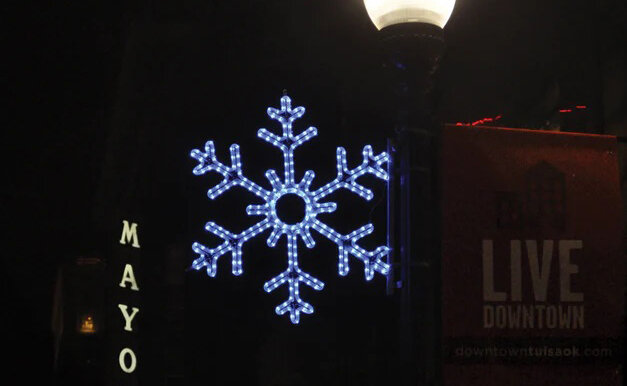 Illuminated snowflakes similar to this one will be coming this winter to a utility pole near you.