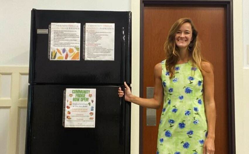 Samantha Bacchi with the new community fridge at the Highland Public Library.