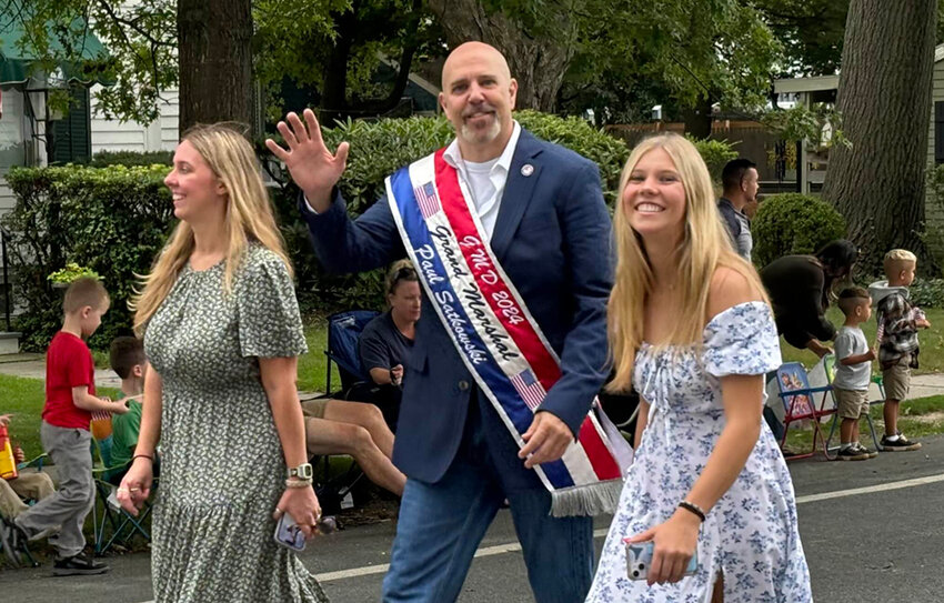 Grand Marshal Paul Satkowski recognizes many friendly faces in the crowd.