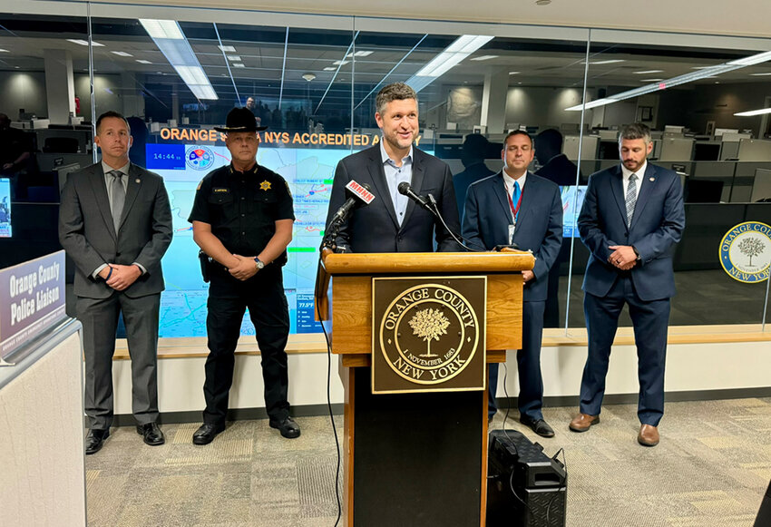 Congressman Pat Ryan speaks at the Orange County Emergency Services Center last week.