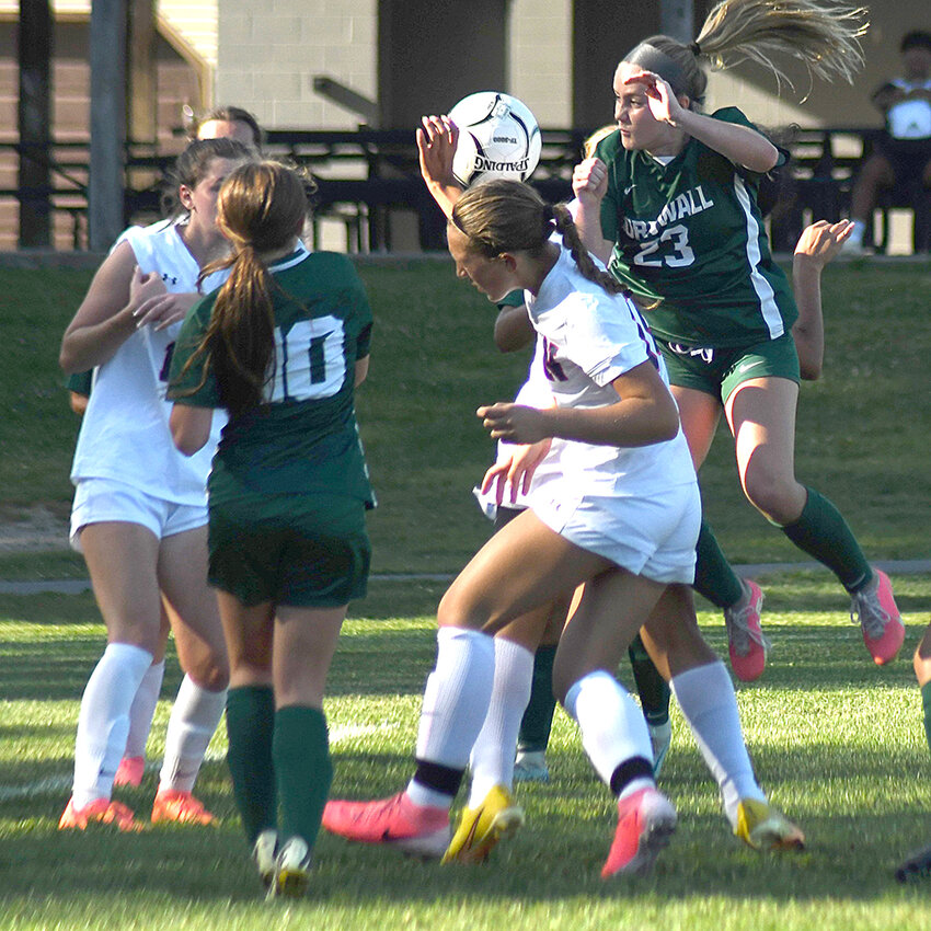 Cornwall’s Jacqueline Weber (23) and Victoria Weber battle for the ball with several Newburgh players during Thursday’s non-league girls’ soccer game.