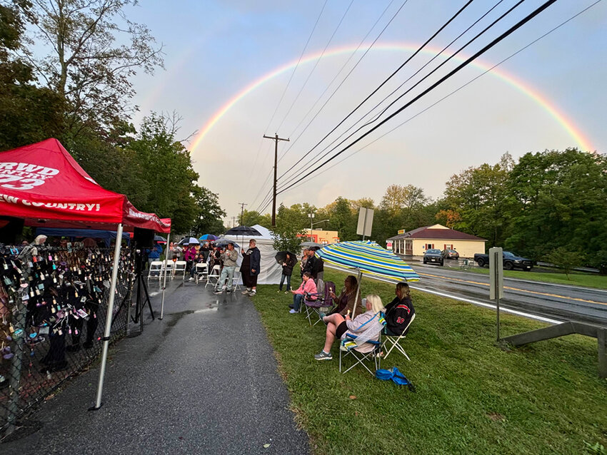 A rainbow punctuated the ceremony.