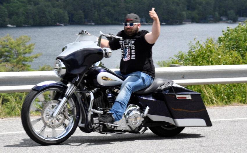 The late Matthew Bewick doing one of the things he loved best, taking a ride on his motorcycle.