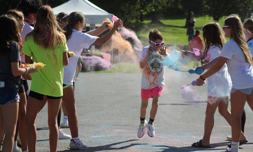 Last October, a young man cruising through the finish line at the 2023 Cornwall Color Run found himself bombarded with color by volunteers working at the event!