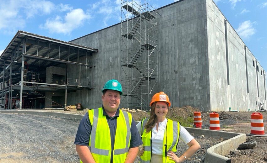 Regional Food Bank CEO Tom Nardacci is shown with Felicia Kalan, new Executive Vice President Hudson Valley, in front of the Food Bank’s new facility under construction in Montgomery.