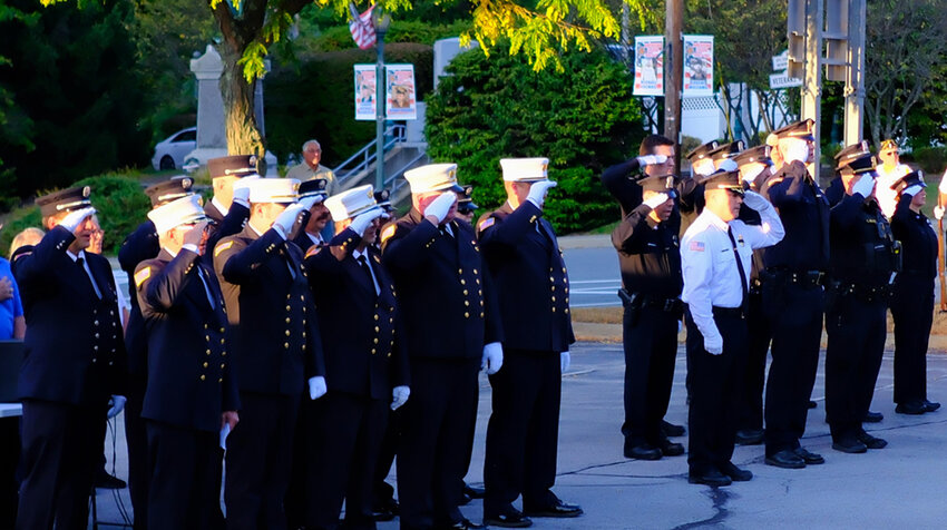 Members of the Lloyd Police Department salute during the Pledge of Allegiance at the September 11th ceremony last week.