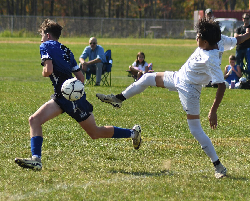 Cornwall’s Andrew Bonet kicks the ball past Valley Central’s Charles Quick during Thursday’s OCIAA Division II boys’ soccer game.