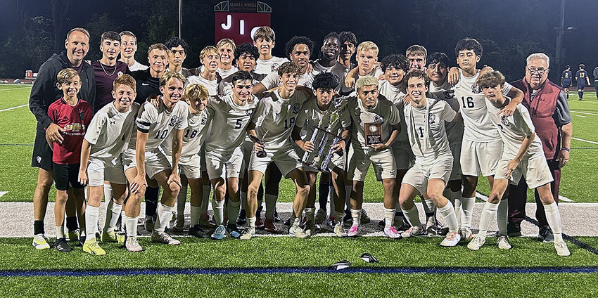 The James I. O’Neill Raiders pose with the trophy after Saturday’s Jimmy Ranieri Memorial Tournament championship boys’ soccer game at James I. O’Neill High School in Highland Falls.