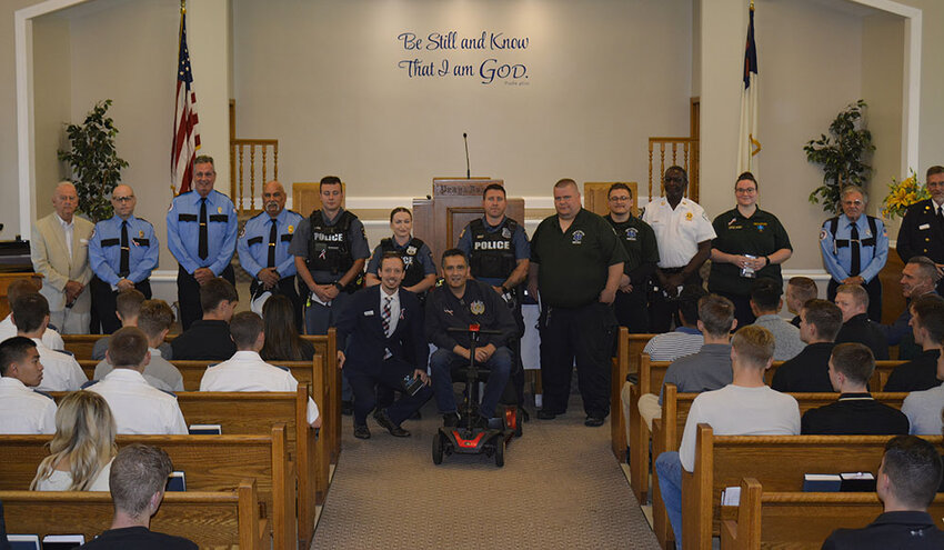 Celebrating Public Safety Service were (back row, l-r) Bob Livsey, Eric Jimenez, Greg Maher, Rich Salva, Kyle Foss, Elizabeth Leonardi, Patrick Kaley, Kyle Shorette, Sean Lewis, Jeffrey Gathers, Christin Byrnes, John Monteleone, and Keith Lamberson; and (front row, l-r) Pastor Andrew Snavely and Rich Fernandez.