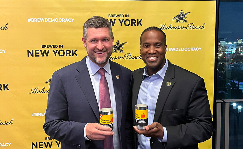 Congressmen Pat Ryan (D-NY) and John James (R-MI) pose with their ‘Spirit Mission’ beer, which was brewed as part of the annual Congressional brewing competition in Washington, DC.