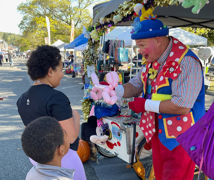 ‘Merlin the Magical Clown’ spent his day facepainting and making balloon art with local children.