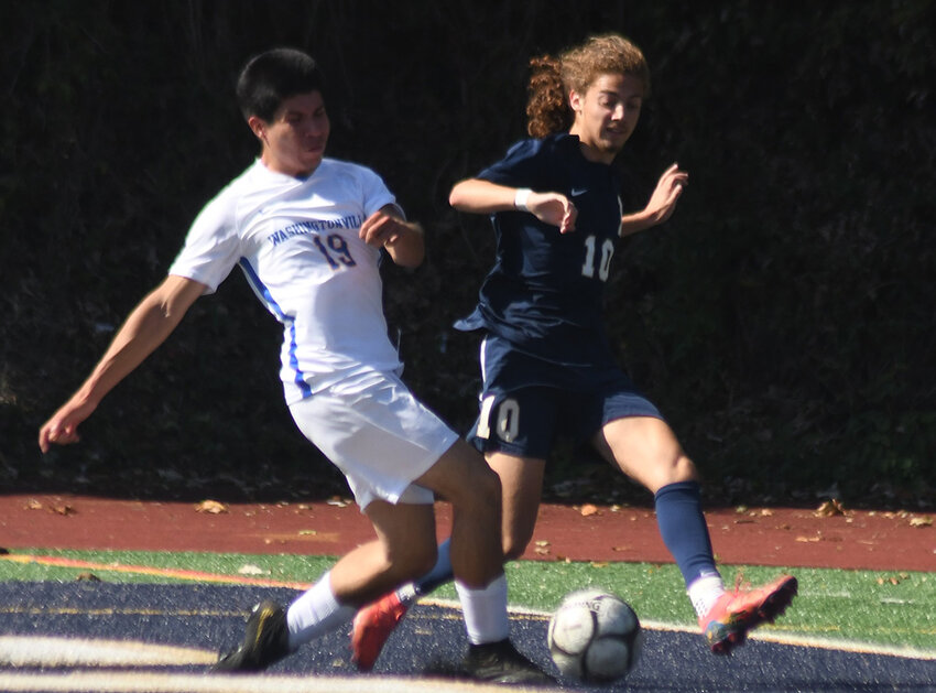 Newburgh’s Nick Thomaz and Washingtonville’s Nicholas Novoa battle for the ball during Saturday’s non-league boys’ soccer game at Academy Field on Newburgh Free Academy’s Main Campus.