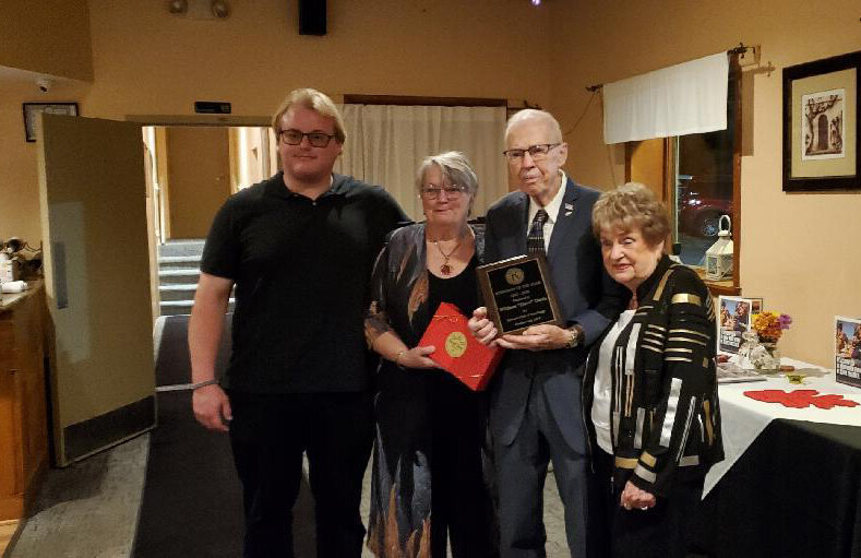 Dave Davis, shown with grandson Mason, daughter Daryl Ann and wife Shirley, was honored as the Kiwanian of the Year.