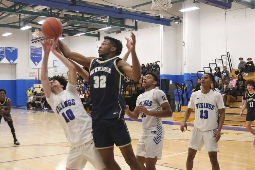Newburgh’s Bruce Marshall comes up with a rebound in last week’s game at Valley Central High School in Montgomery.