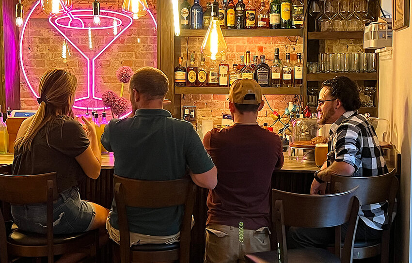 Patrons of Toasted enjoy drinks at the bar at one of the many events held. After four years of business, Toasted on Liberty Street hosted its final event on Saturday, February 15.