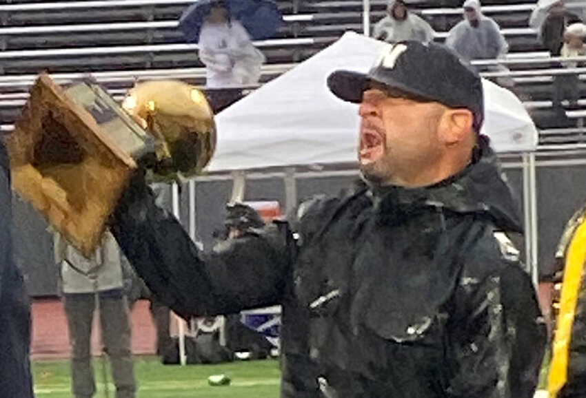 Former Newburgh Free Academy Football Coach Bill Bianco, holding the Section 9 trophy his team won in 2021.