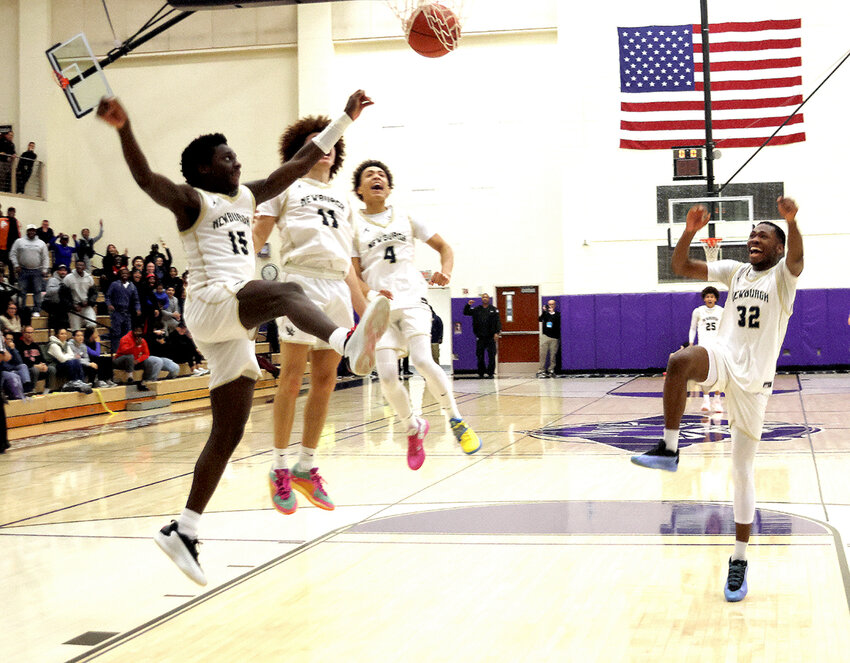 Newburgh’s Jashir Davis (15) celebrates his game-clinching bucket, while teammates Shaun Gonzalez (11), Jaedan Pagan (4) and Bryce Marshall (32) share the moment.