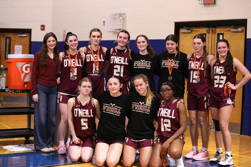 Section 9 runner-up O’Neill Raiders pose with their medals after the game.