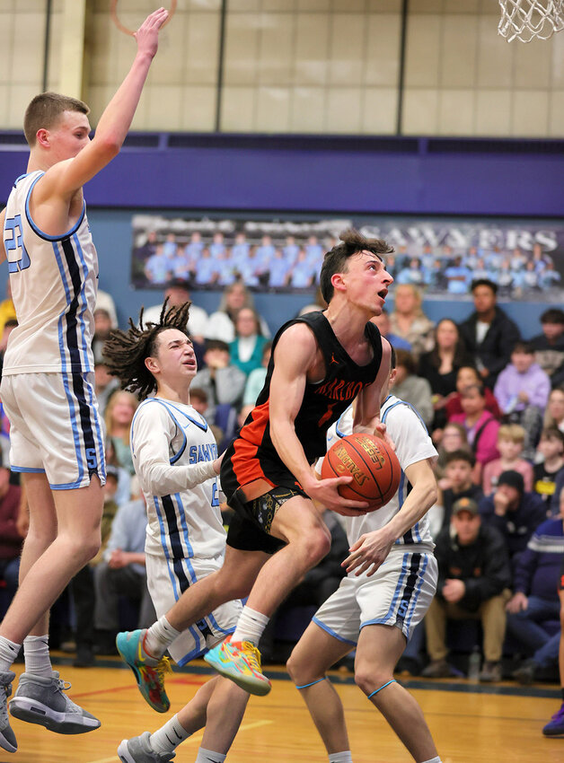 Chris DeNatale drives to the rim during the third quarter in the Section 9 Semi-Final against Saugerties.