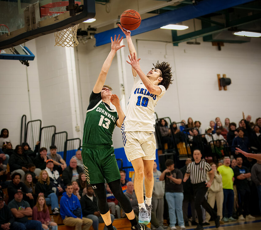 Jalen Mojica drives to basket as Cornwall&rsquo;s Jayden Wendt defends.
