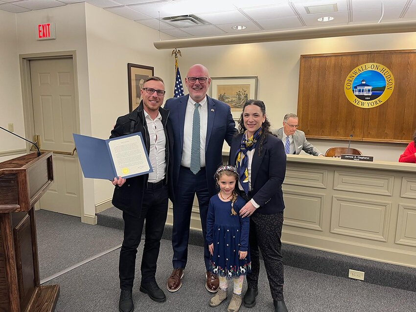 Daniel Dimitrov, his wife Alexandra and daughter Claire stand with Cornwall-on-Hudson Mayor James Gagliano at the Village Board&rsquo;s March 24 meeting, where he was presented with an unexpected proclamation.