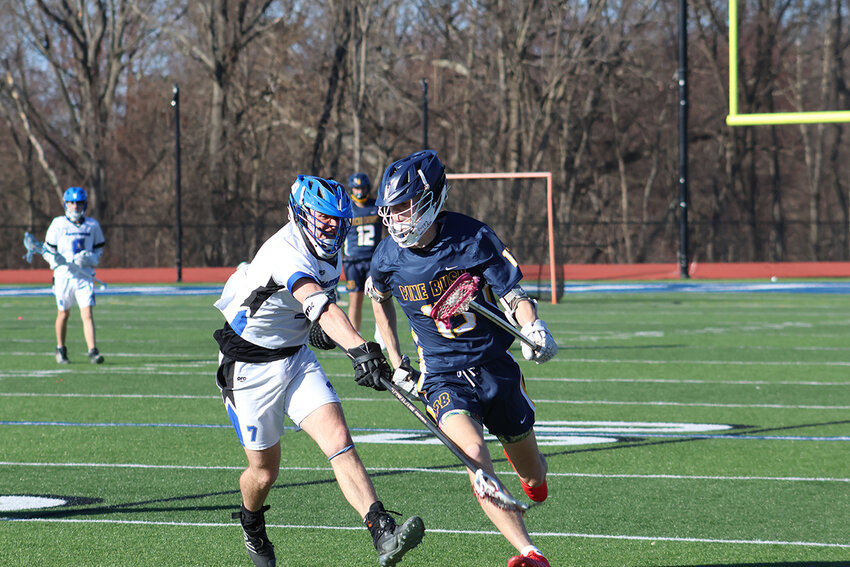 Kaine Riddick (13) of Pine Bush bring the ball upfield.