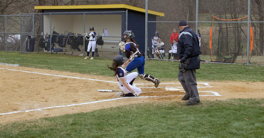 Violet Brienza scores a run for the Huskies in Wednesday’s loss to Wallkill.