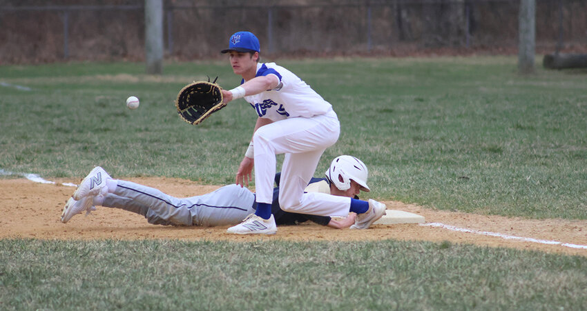 Viking first baseman Caleb Swart fields a pickoff attempt.