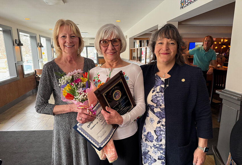 Town of Highlands Democratic Committee Chair Lynn Edsall (l) and Orange County Legislator Laurie Tautel surround Highland Falls’ Olga Anderson at last Saturday’s Evelyn Drew Memorial Service Award brunch at Barnstormer Restaurant.