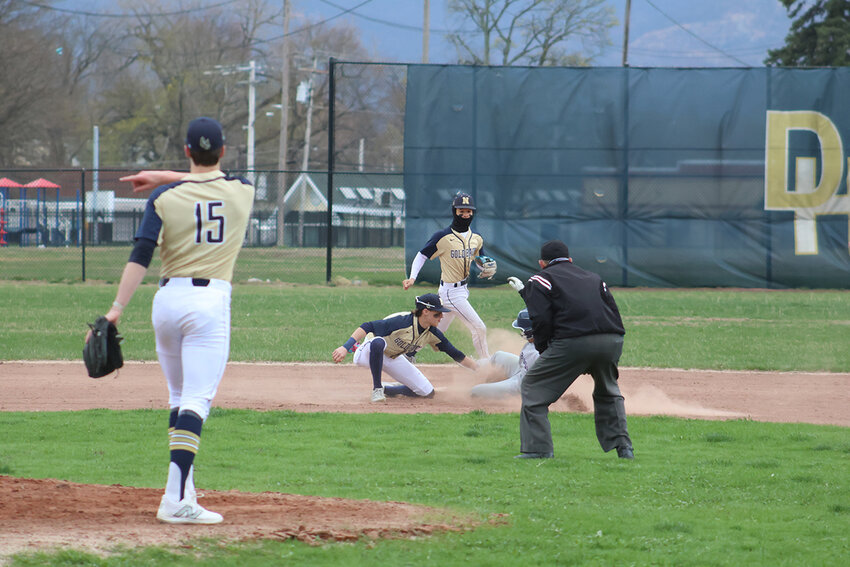 Newburgh’s Jake Cross applies a tag to a Pine Bush baserunner in Thursday’s 4-3 win.