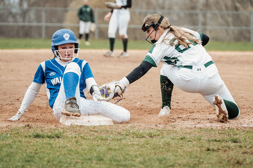 Emma Hunt is safe at third.