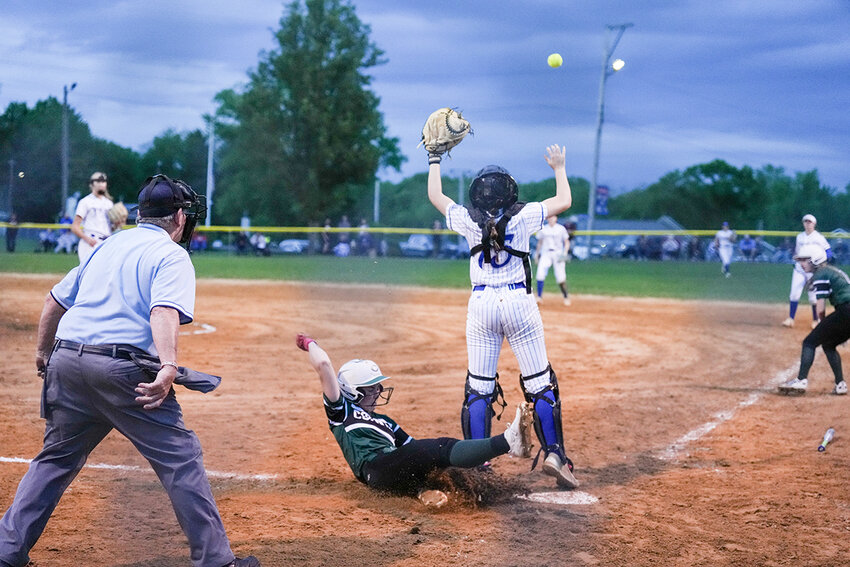Alana Hayes slides safely into home.