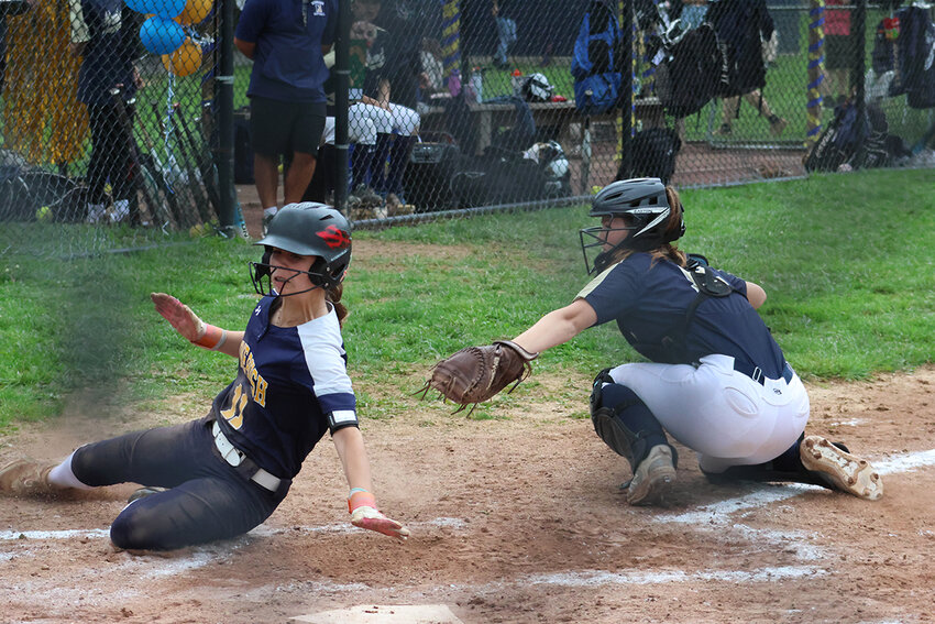Mackenzie Castro slides home safely for Pine Bush in last week’s game at Newburgh.