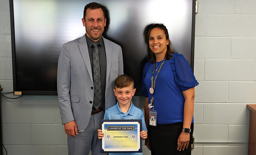 Highland Elementary School Leader of the Pack, Anthony Vida, stands between Principal Ian MacCormack and Asst. Principal Dr. Malissa Chester.
