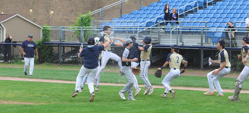 The Newburgh Free Academy Goldbacks celebrate a walkoff win over Monroe-Woodbury on May 27, in the Section 9, Class AAA semifinal.