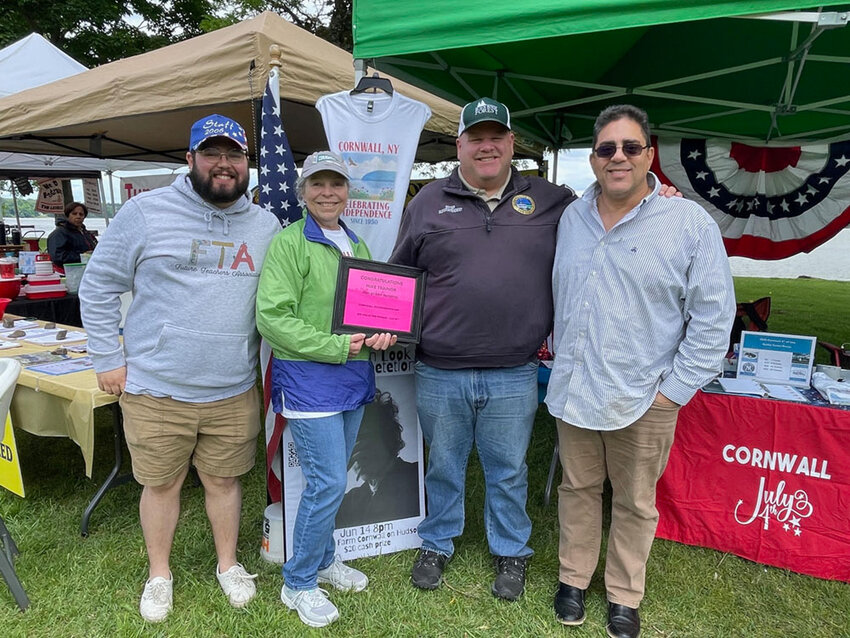 Scott Rolon, Maryann O’Dell and Bill Rolon surround Cornwall-on-Hudson’s Mike Trainor at last week’s Riverfest. Trainor was recently named grand marshal of the community’s Fourth of July parade.