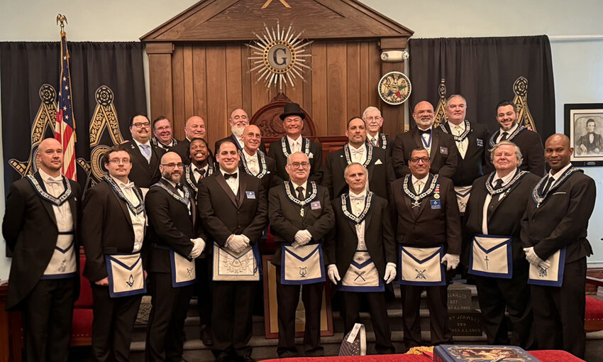 Conklin (hat) standing with the lodge’s Mason Masters.