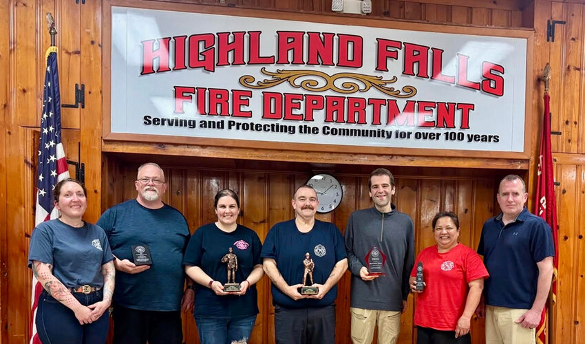 HFFD President Clarissa Marvin and Chief Erik Smith flank the department’s 2024 award winners last week. From left: firefighters John Rush, Emma and Joe Rogers, Matt Troy and Arla James.