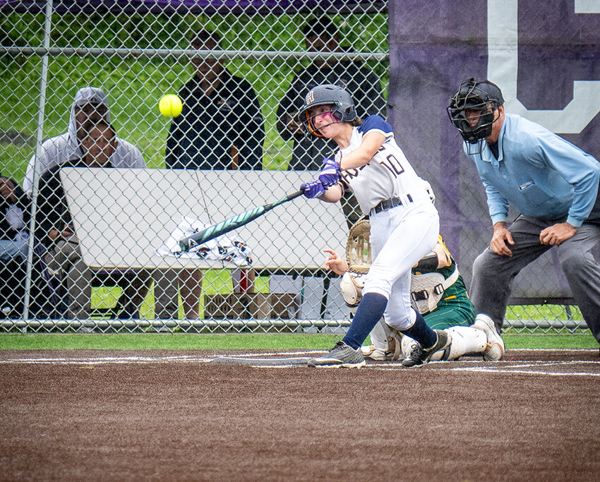 Highland’s Violet Brienza connects during last Monday’s 17-2 win over Hastings in the Class B quarterfinal.