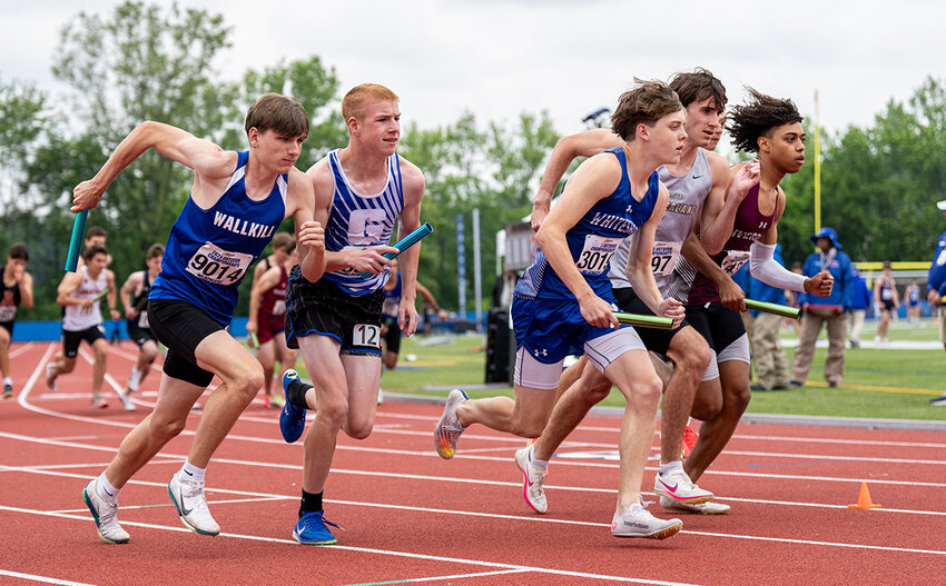 Jamison Warren of Wallkill (far left) makes his move in the 4x800 Boys Relay Championship, Saturday, at Middletown.