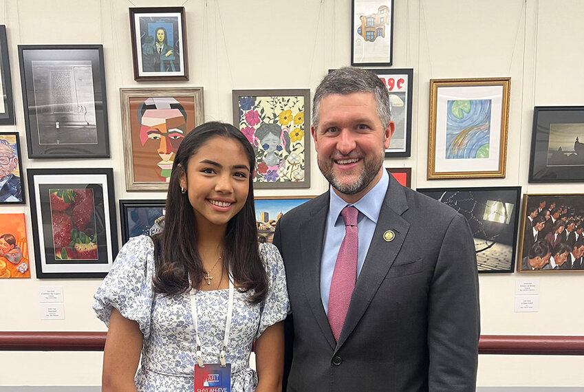 With her artwork behind them, West Point’s Shylah-Eve Guy and Congressman Pat Ryan are shown in Washington DC on June 11.