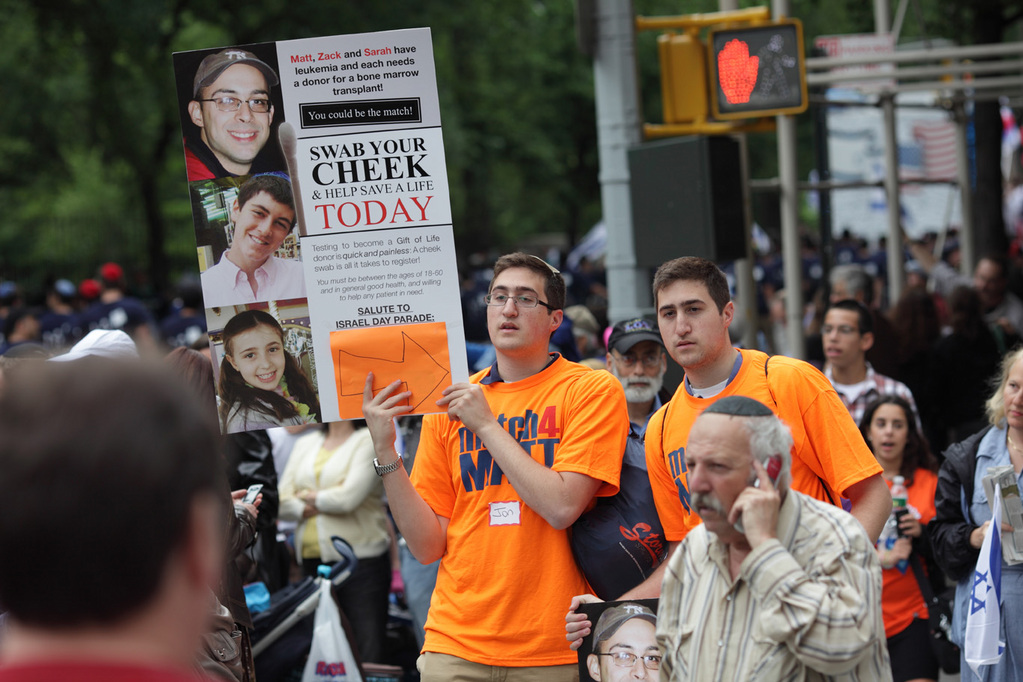 Jon, left, and Eric Moerdler were among the volunteers asking people to conduct a cheek swab at Temple Emanu-El to see if they are bone marrow matches for three leukemia patients during the Salute to Israel parade on 5th Avenue in Manhattan on Sunday, May 23, 2010.  The Moerdlers are friends of one of the patients, Zack Englander.