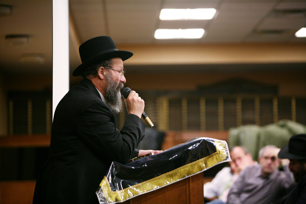 Rabbi Nachman Holtzberg, father of Rabbi Gavriel Holtzberg, who was killed along with his wife Rivka in the terrorist attacks in Mumbai last month, speaks at a memorial service at Young Israel of West Hempstead on Sunday, December 21, 2008. The elder Holtzberg spoke after a video biography of his son's life was shown to the gathering of about 350.