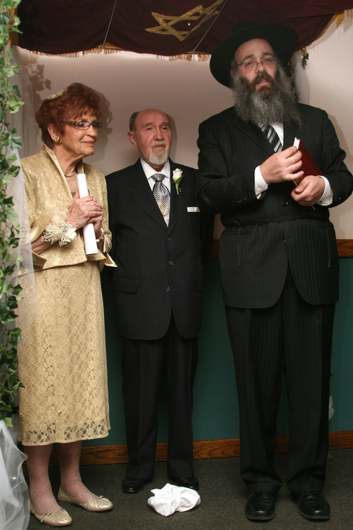 Gloria Schreiber and Harry Katz with Rabbi Shneur Z. Wolowik of Chabad Center of the Five Towns.