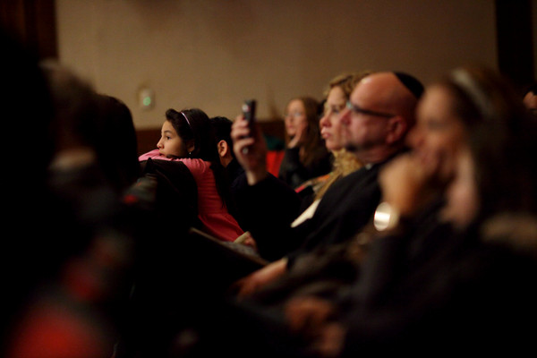 Audience members listen to Chaim Dovid during a concert at Lawrence High School, Wednesday, January 5, 2011.