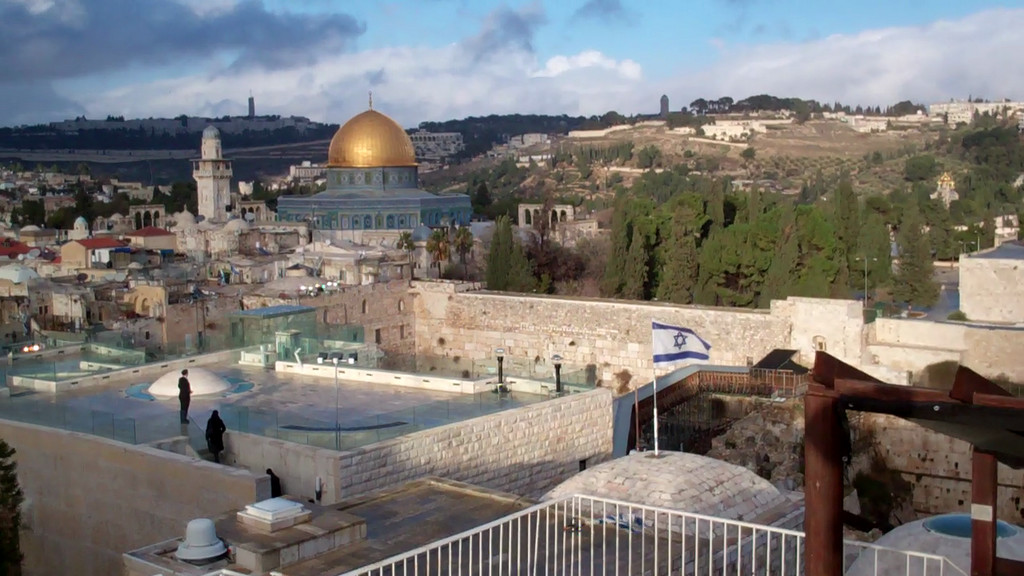 Taken atop Yeshivat Orayta, an Israeli flag stands proudly in the forefront while stones of the Kotel shine in the background. Photo by Adam Nesenoff, son of The Jewish Star&rsquo;s new publisher. Adam submitted the photo with hatzlacha and good wishes to the entire staff and to all the readers.