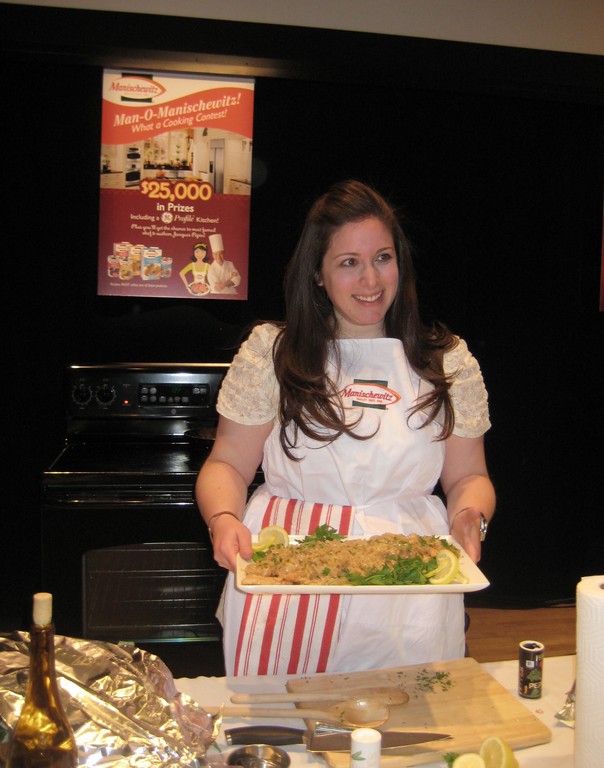 Dina Burcat presents her shallot smothered chicken covered in matzo meal for the Manischewitz cook-off.