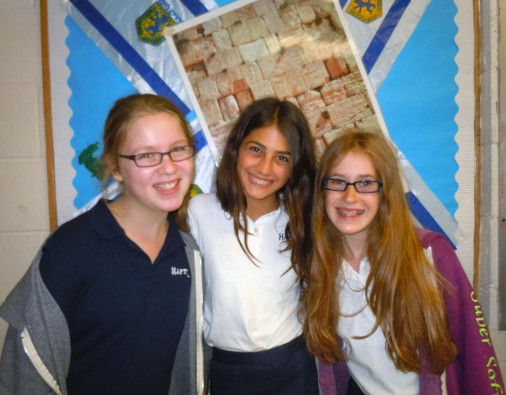 Seventh graders (l-r) Ayelet Segal, Chloe Thall, and Haley Ottensoser, recognized essay writers.