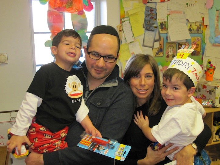 Cedarhurst music producer Avi Newmark with his wife Tamar and two of his  sons.